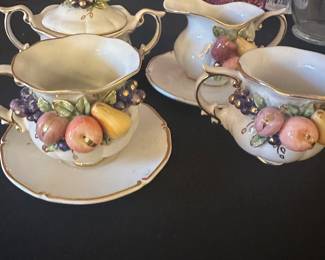 vintage porcelain set with a fruit design and gold trim