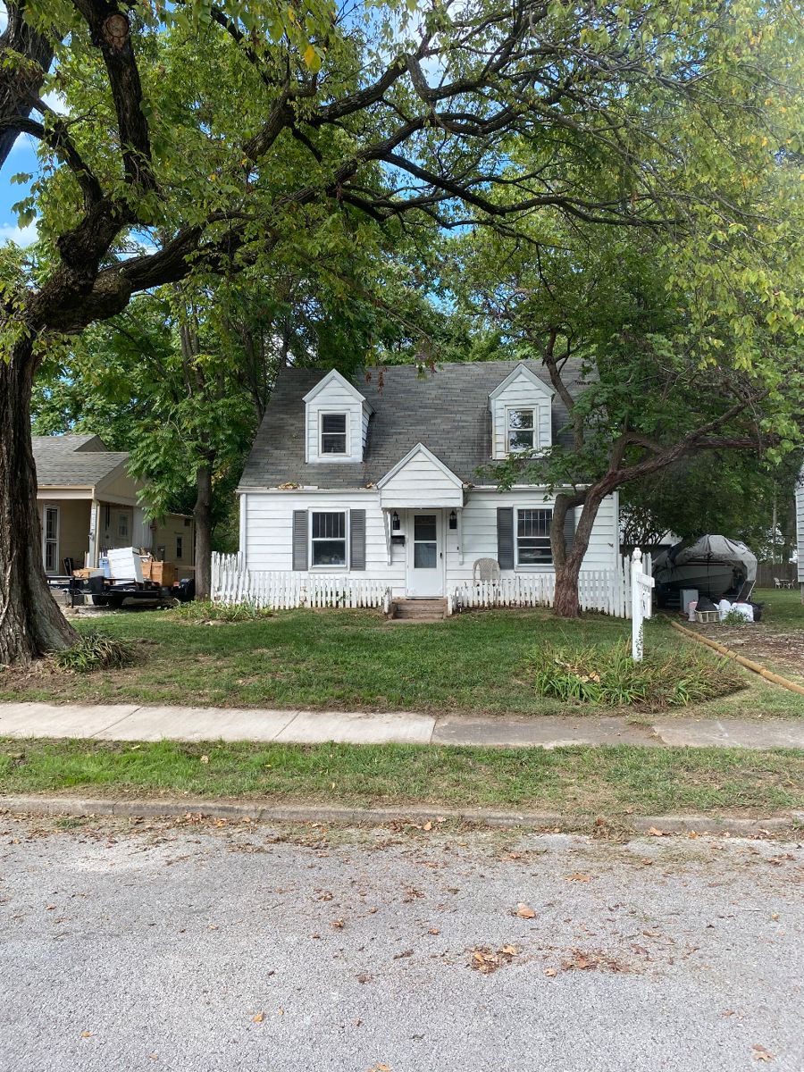 The  cute little cottage on university where the sale will be held