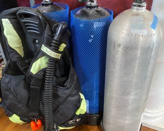 3 scuba air tanks and scuba vest