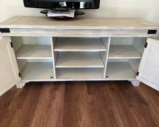 $150 Modern driftwood-colored console media cabinet; 32.25” high x 66” wide x 19” deep 