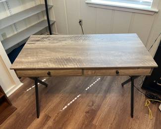 $75 Contemporary desk, driftwood finish with metal frame, two drawers; 30 inches high by 43 1/4 inches wide by 20 1/2 inches deep.