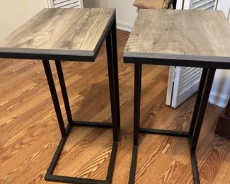 $60 Pair of contemporary metal and laminate side tables; 26” high x 12” wide x 15” deep. 