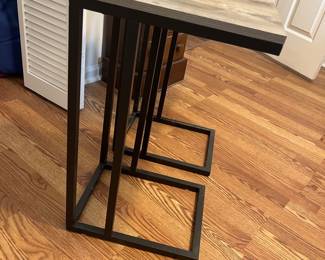 $60 Pair of contemporary metal and laminate side tables; 26” high x 12” wide x 15” deep. 