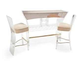 2039
A Luigi Bardini Lucite bar set for Hill Manufacturing Company
Late 20th century
One stool with tag: Hill Manufacturing Company
Comprising a Lucite bar with faux metal-mounted side paneling and a smoky glass top above fitted bottle and stemware storage compartments, with two conforming barstools, the seats upholstered in a beige fabric
3 pieces
Bar: 40" H x 54.75" W x 17.75" D; Each stool: 40" H x 16" W x 19.5" D
Estimate: $600 - $800