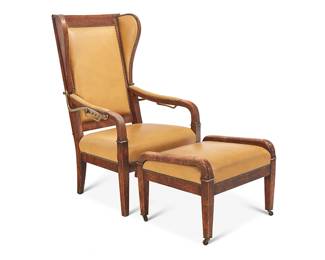 2069
A wingback reclining chair and ottoman
Early 20th century
The wood chair with leather upholstery and brass tacking, featuring a reclining mechanism engaged at armrests with five settings, including conforming ottoman set on casters
2 pieces
Chair upright: 48.25" H x 27.25" W x 30" D; Ottoman: 18" H x 24.25" W x 21" D
Estimate: $500 - $700