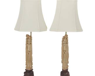 2216
A pair of Asian carved hardstone lamps
Mid-20th century
The single-light lamps, each with carved stone figural standard mounted on a brass base, surmounted by a fabric shade and a carved stone finial depicting two phoenixes, electrified
2 pieces
Each overall: 29" H x 10.25" W x 8.5" D
Estimate: $300 - $500