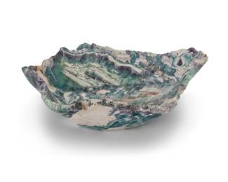 2091
A fluorite specimen bowl
20th/early 21st century
Including green, purple, and white banding
6.5" H x 21.5" W x 17.5" D
29.5 lbs.
Estimate: $300 - $500