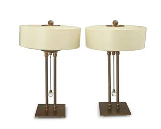 2139
A pair of Modern table lamps
Mid-20th century
Each unmarked
The three-light lamps, each with a brass base and standard issuing a brass and glass pull, surmounted by a powder-coated metal shade with upper and lower diffuser, electrified
2 pieces
Each overall: 17.5" H x 11" Dia.
Estimate: $400 - $600
