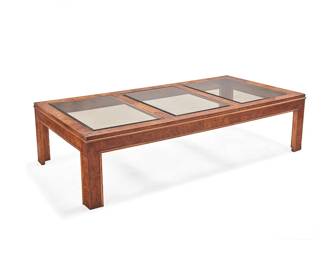 2280
A Glenn of California burlwood coffee table
Late 20th century
The table with three inset smoky glass panels
15" H x 60.5" W x 30.5" D
Estimate: $400 - $600