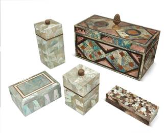 2072
A group of mother of pearl-clad table boxes including Maitland-Smith
Late 20th century
One with sticker to underside: Maitland-Smith / Hand Made in Philippines; graduated boxes with sticker: Marquis Collection of Beverly Hills
Comprising a large Maitland-Smith box with inner fitted compartment and pinecone finial, two smaller boxes with hinged lids, and two graduated sizes of lidded boxes, each lined with felt
5 pieces
Largest: 10.75" H x 16" W x 8" D; Shortest: 1.75" H x 8.125" W x 3.125" D
Estimate: $300 - $500