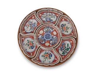 2231
A Japanese porcelain sweet-meat set
20th century
Each piece and tray marked: Japan
The seven-piece set of enameled ceramic dishes, each depicting foliate scenes, set in a wood box
Overall: 1.25" H x 13.5" Dia.
Estimate: $200 - $300
