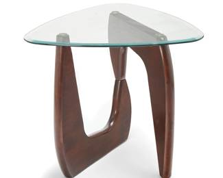 2035
A Noguchi-style side table
Early 21st century
Unmarked
In the manner of Isamu Noguchi (1904-1988), the free-form side table with swiveling wood base and beveled glass triangular top
Overall: 24.5" H x 27.25" W x 28.25" D
Estimate: $200 - $400