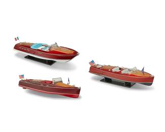 2205
Three lacquered wood model speedboats
Mid/late 20th century
Each with leather seats and silver-toned plastic components, comprising a Riva Super Ariston model (8.25" H x 35" W x 10.75" D), a Chris-Craft Triple Cockpit model (6.75" H x 31.5" W x 8.625" D), and a Chris-Craft Runabout model (7.75" H x 32.5" W x 9.75" D), the first two set on acrylic stands
3 pieces
Estimate: $500 - $700