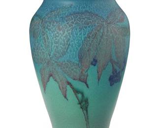 2100
A Rookwood pottery vase
1928, designed by Elizabeth N. Lincoln
Marked for Rookwood; further marked: XXVIII / 2996; signed: LNL [Elizabeth N. Lincoln (1892-1931)]
The ceramic vase with 'Butterfat' glaze, depicting woodbine leaves and berries
8.75" H x 5.75" Dia.
Estimate: $400 - $600