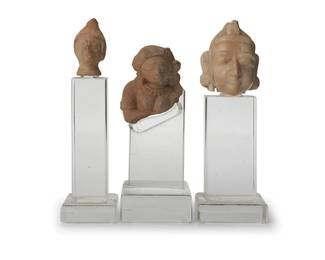 2245
Three carved stone deity heads
20th century or earlier
Each mounted on an acrylic stand, comprising two Southeast Asian heads and a possibly Mesoamerican head
3 pieces
Largest stone: 4.375" H x 3.625" W x 3.625" D; Middle overall: 10.125" H x 4.125" W x 4.125" D
Estimate: $300 - $500