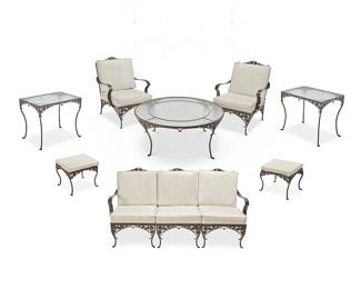 2272
A collection of Brown Jordan 'Morning Glory' patio furniture
Early 21st century
The enameled metal set, each with white vinyl-upholstered seat cushions, comprising a three-piece sectional sofa (36" H x 71" W x 34" D), a large coffee table with glass top (17.75" H x 42" Dia.), two armchairs (35.75" H x 26" W x 32" D), two ottomans (13.25" H x 17.5" W x 17.5" D), and two rectangular side tables with glass tops (24" H x 29" W x 21" D)
10 pieces
Estimate: $1,000 - $2,000