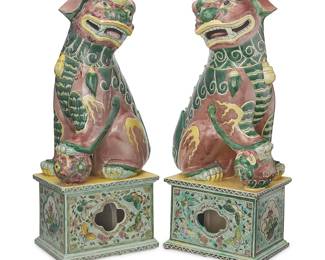 2213
A pair of Chinese glazed ceramic guardian lions
20th century
One depicted with paw on a pup, the other with paw on a sphere, each mounted on a pedestal decorated with floral motifs
2 pieces
Each: 24" H x 9.5" W x 10.25" D
Estimate: $400 - $600