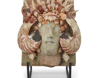 2192
A Contemporary shell-encrusted plaque
20th century
Unmarked
With a ceramic face in relief on a rectangular backing, mounted with various seashells, set on an enameled metal display easel
13.5" H x 9.75" W x 5.625" D; Easel: 13" H x 6.75" W x 6.75" D
Estimate: $300 - $500