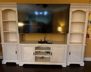 Large wall cabinet and 85 inch smart TV