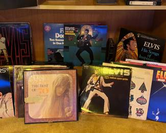 Lots of vinyl records, including Elvis Presley, Kenny Rogers, and Alabama. 