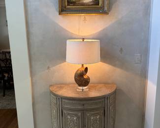 Drexel Heritage 1 Drawer / 2 Door Demilune Storage Cabinet with Decorative Shell Table Lamp & Framed Original Oil on Canvas of Cottage Landscape Signed Laura (24"W x 20"H)