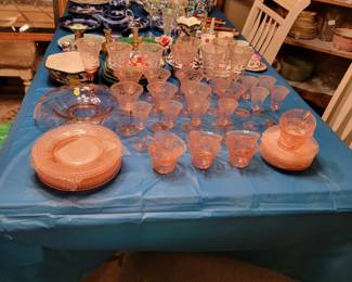 Cambridge elegant  pink glasses,cups and saucers and  cake plates  no chips 8 of each. Blue onion  canisters and utensils  in back,