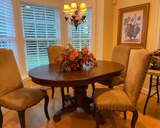 Pottery Barn dining furniture and floral arrangement