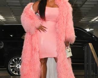 Claire Summers wearing a full length Mongolian by FGM BESPOKE Furs. 
