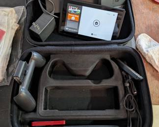 Nintendo Switch V2 (HAC-001-01) console with dock, gray Joy-Cons, two grips, charger, and travel case