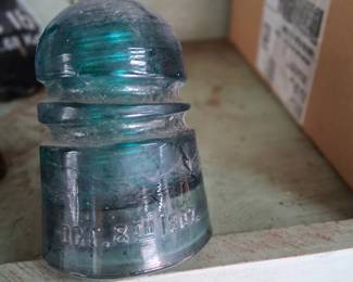 TELEPHONE LINE INSULATOR. WE HAVE SEVERAL OF THESE (BLUE, CLEAR, BROWN)