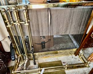 Brass fireplace fender, six piece fireplace tool set