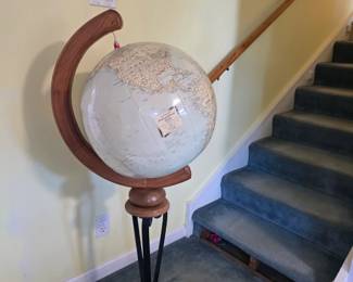 Vintage inflatable globe on stand.