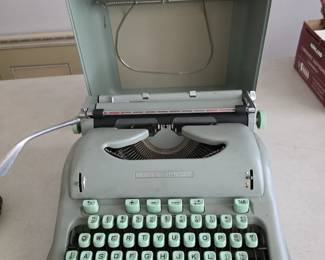 Hermes 3000 cursive typewriter.