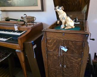 A Victrola in working condition which was originally sold through a Colorado Springs store. A German dog figurine is on top