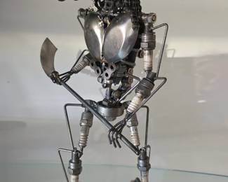 Artist assemblage of alien warrior with moveable parts. 