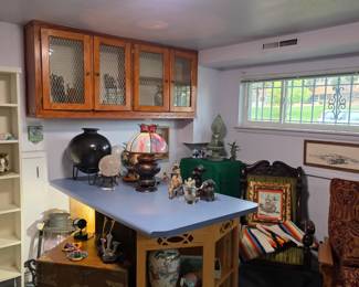 Lower level view - quartz crystal orb on stand, large black pot on stand, 