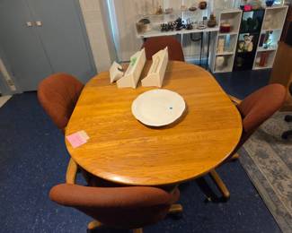 Dinette with 4 wheeled chairs.