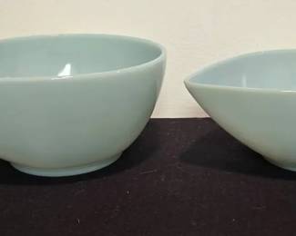 Vintage Fire-King Delphite Blue Teardrop Mixing Bowls (Set of 2)
A beautiful pair of Fire-King Delphite blue mixing bowls, crafted in the classic teardrop (or tear-shape) design. These iconic mid-century bowls are highly collectible for their pastel hue and practical form.
(2) Fire-King Delphite blue mixing bowls
Sizes: 7 1/2" D x 4" H & 6 1/4" D x 3 1/4" H
Marked Made in U.S.A.
Market Insights:
Fire-King Delphite blue pieces are some of the most sought-after in the Fire-King line due to their soft pastel color & mid-century charm. Teardrop mixing bowls like these typically sell in the $40–$80 range per bowl, with sets commanding higher values among collectors. Their timeless design makes them both a display-worthy collectible and a functional kitchen classic.
