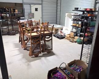 Boxes of Mardi Gras beads, throws, NYX purse, incense sticks, books