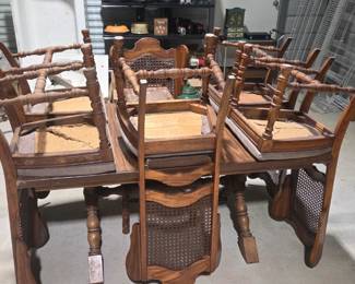 Early 2000s solid wood dining table and chairs. Has extender. 2 chairs need bottoms replacing. 