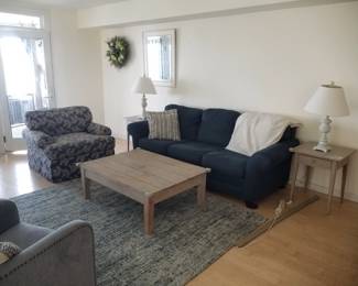 Navy sleeper sofa by Bassett; coffee table; matching end tables & table lamps