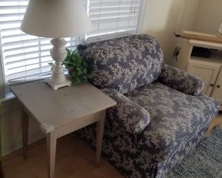 Accent table; table lamp; upholstered chair