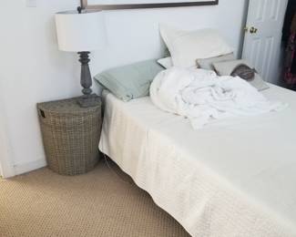 Double bed; hamper; table lamp; art