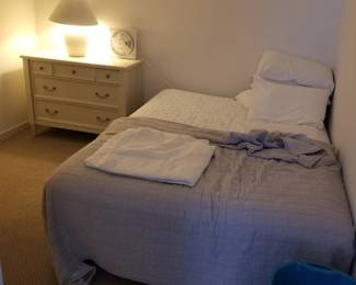 Double bed; dresser; table lamp