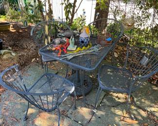 One of 3 wrought iron outdoor tables
