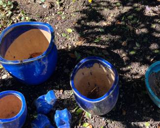 Lots and lots of pots, yard art, trellises, etc
