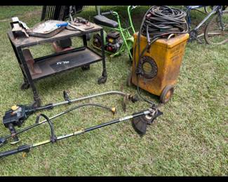 Utility cart, weed eaters, old welding machine 