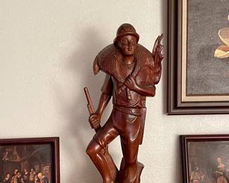 CARVED WOOD HUNTER FIGURINE