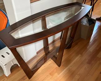 This is a Steve Silver Rafael Demilune Merlot Cherry Sofa Table. Very cool looking!