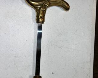 Nude lady brass handle with hidden knife walking cane.